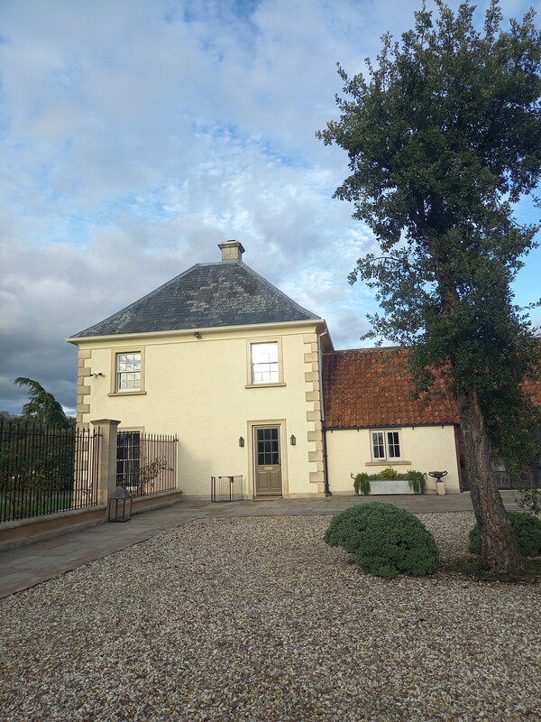 A freshly-painted cream-coloured house.